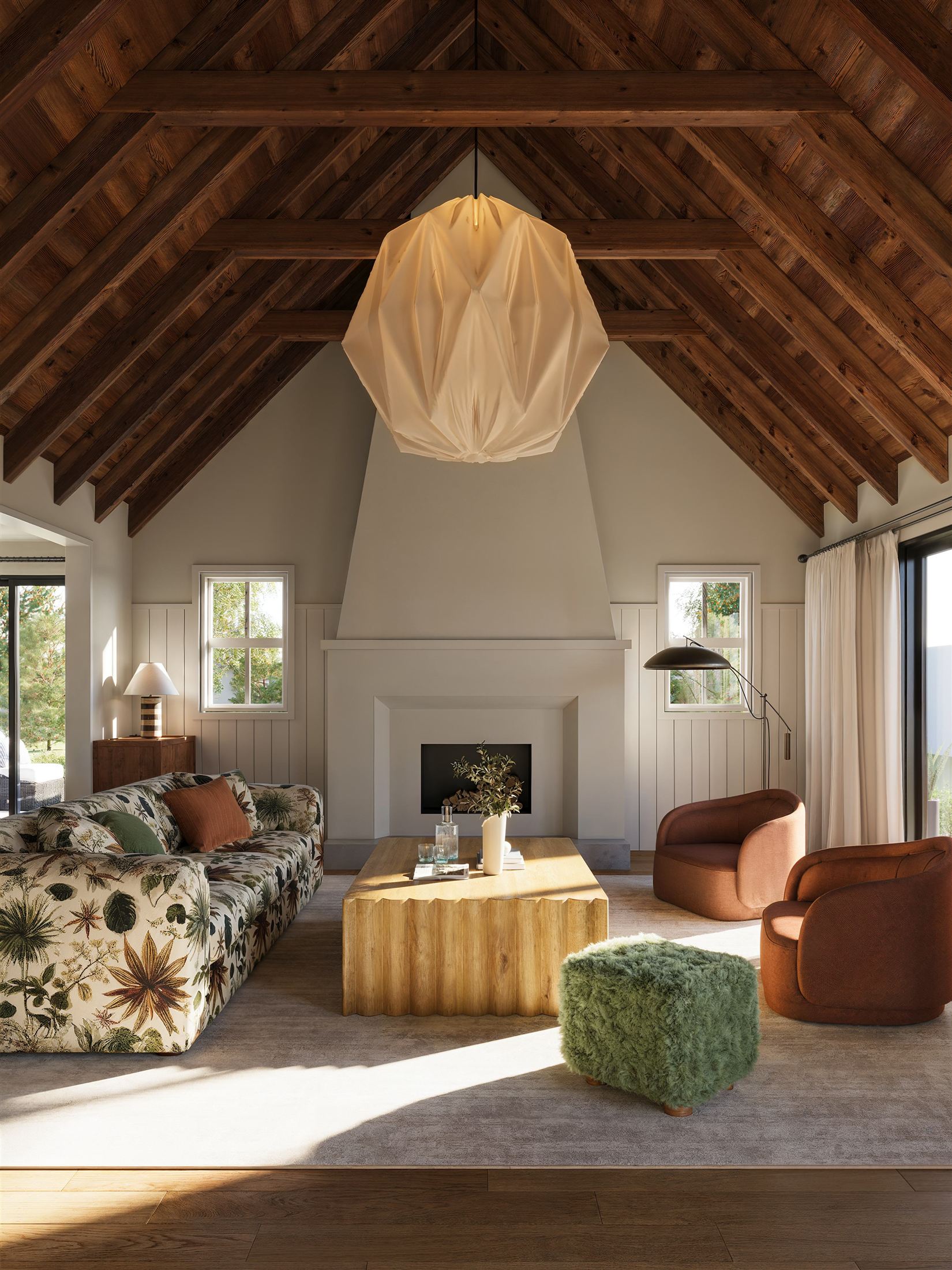 Vaulted living room with timber rafters, a paper lantern and afternoon light across the floor